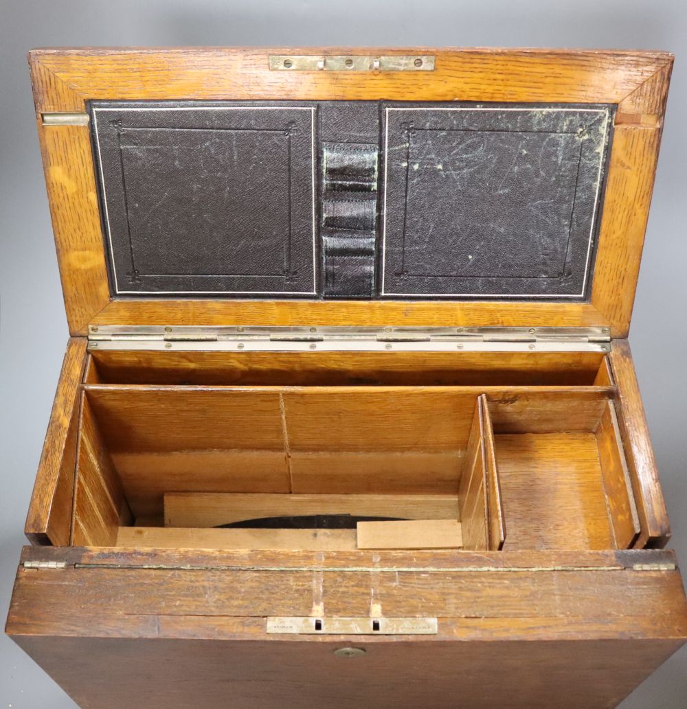 An oak fall-front portable desk